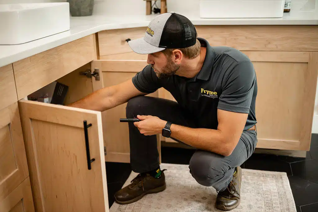 a man sitting in a kitchen